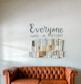 a brown leather couch sitting in front of a white wall