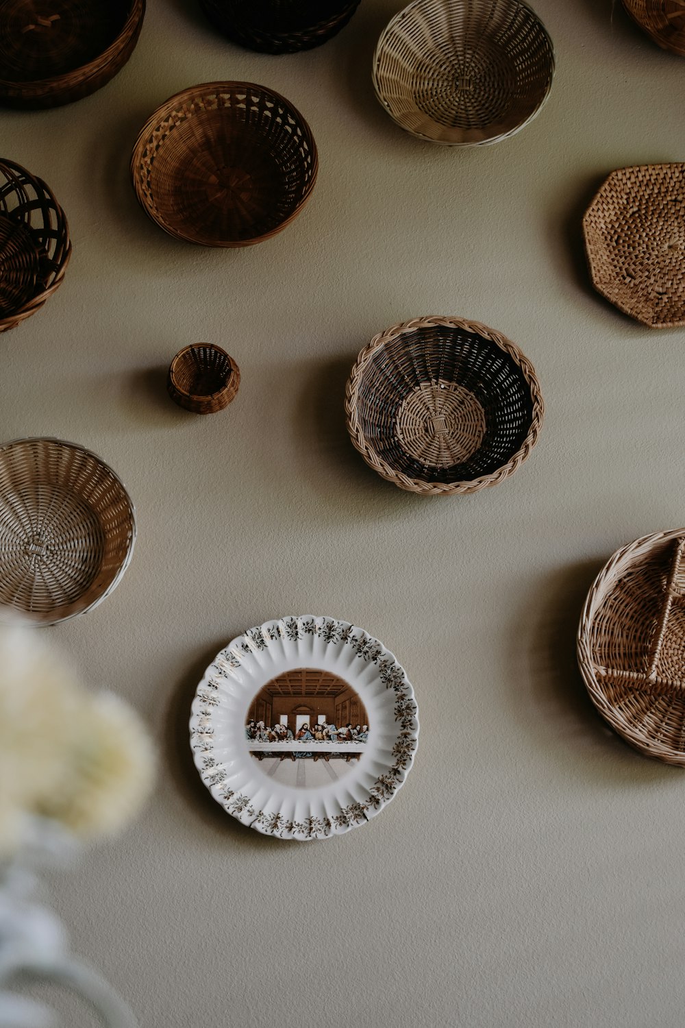 a table topped with baskets and plates on top of a table