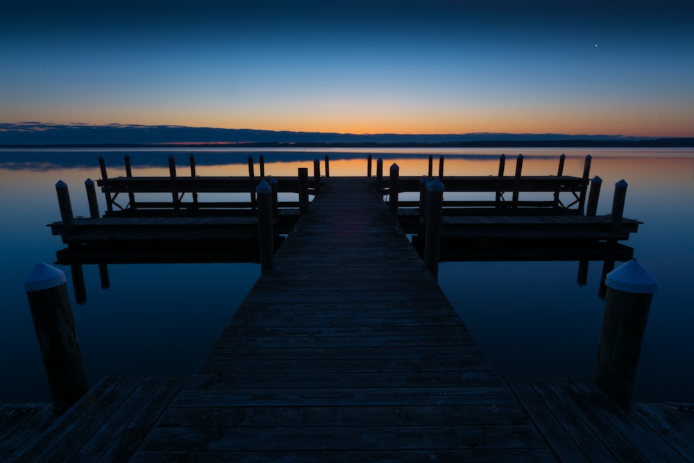 a dock that is sitting in the middle of a body of water