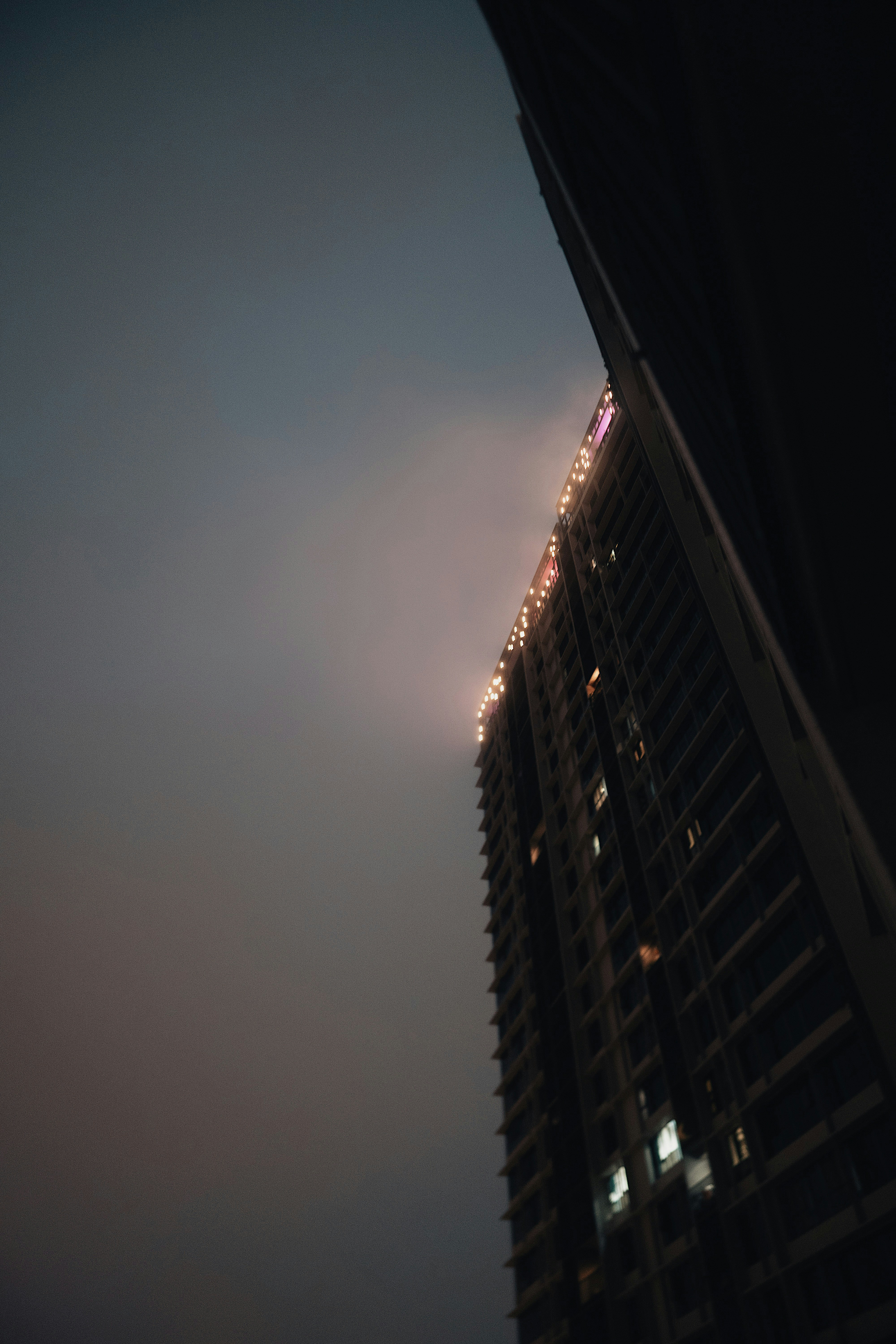 a tall building with lights on top of it