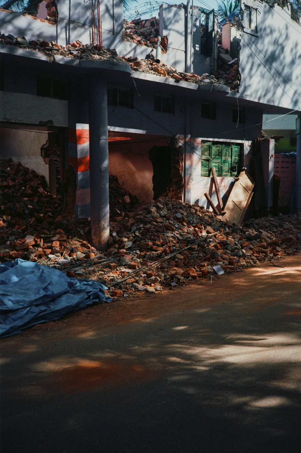 a pile of rubble sitting in front of a building