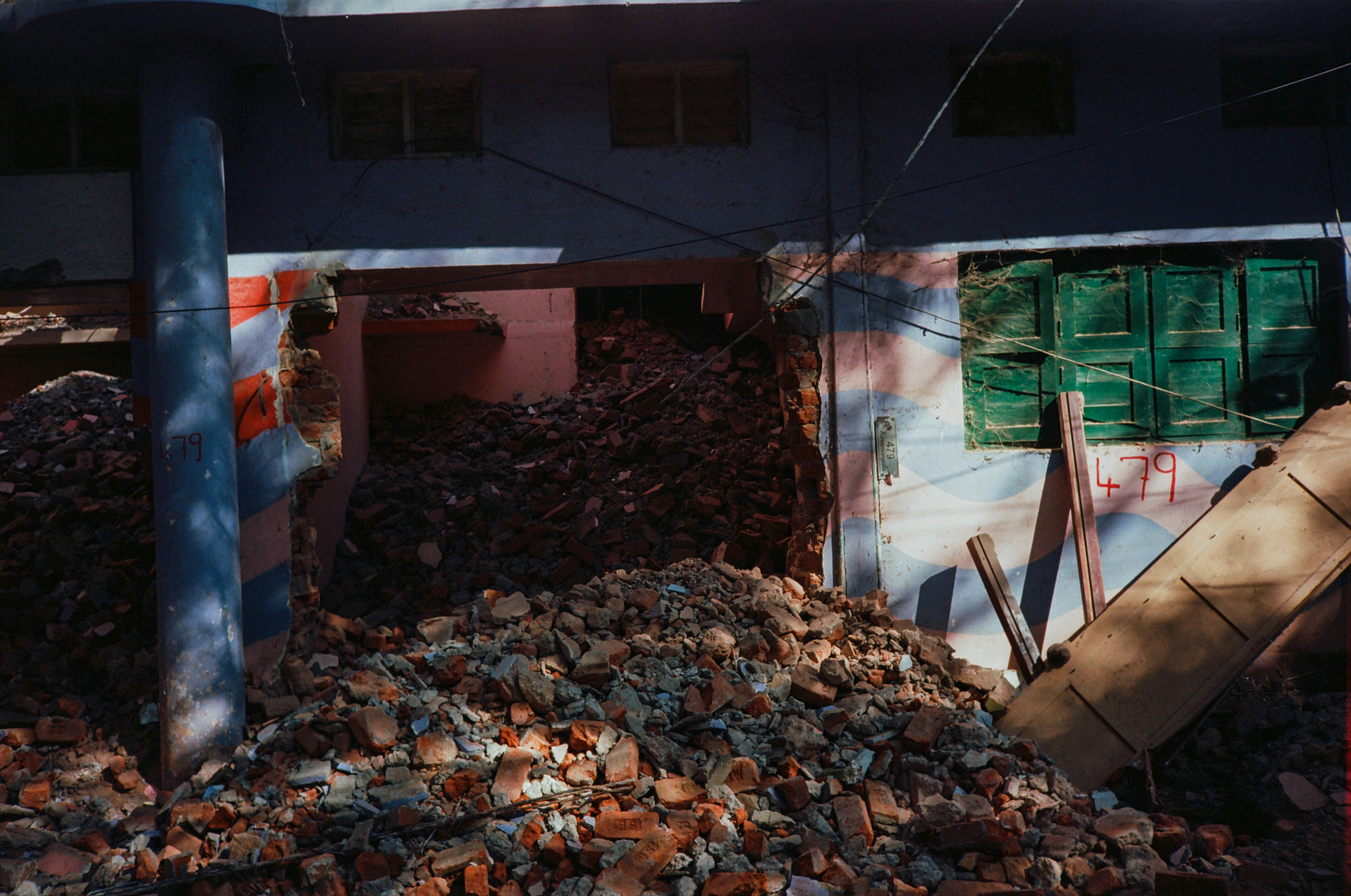 a pile of rubble in front of a building