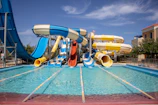 a water park with a water slide and slides