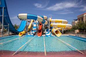 a water park with a water slide and slides