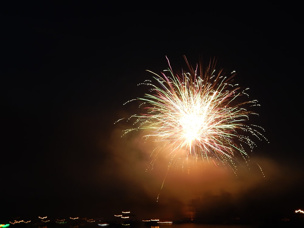 a fireworks is lit up in the night sky