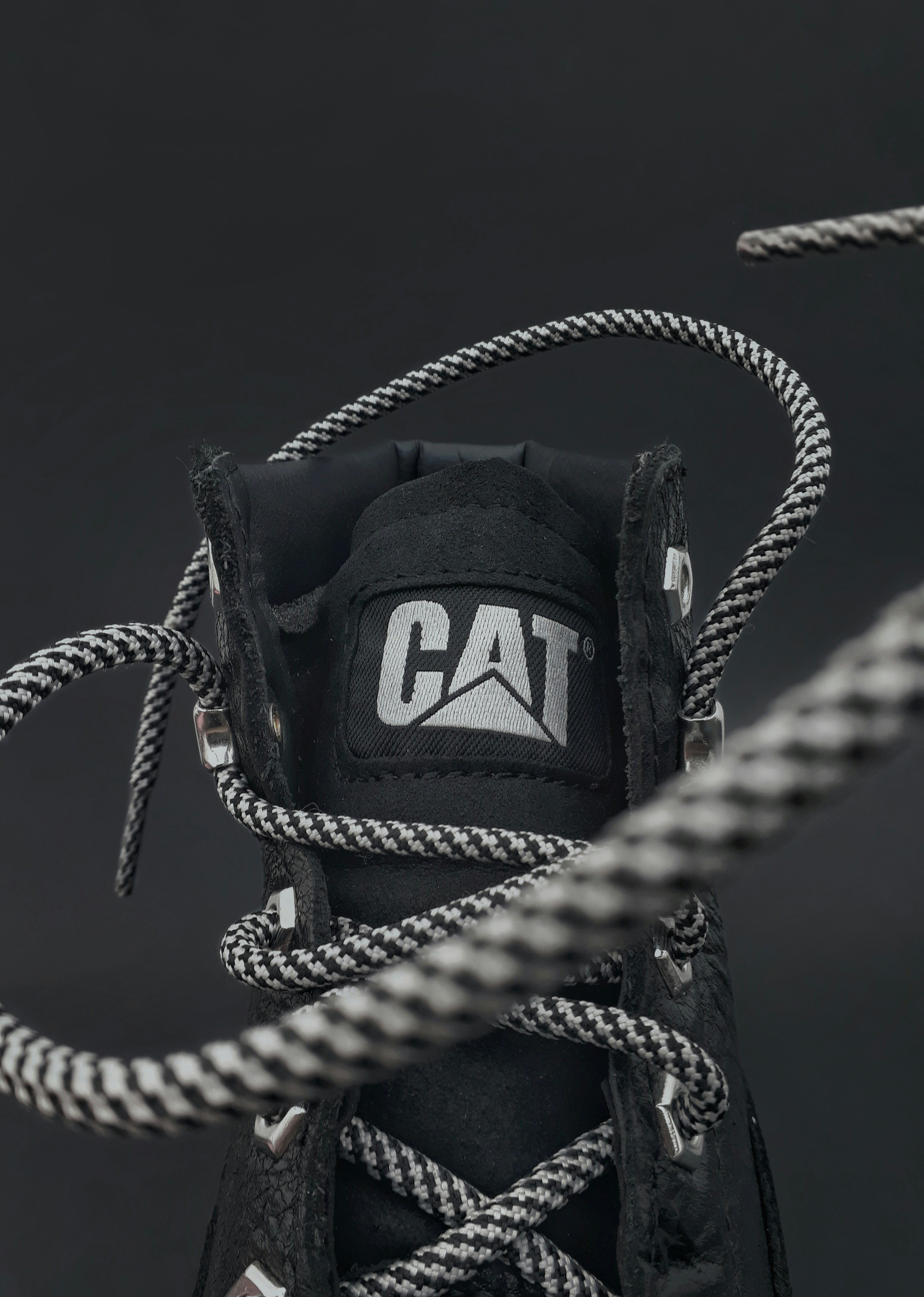 a close up of a shoe with a rope