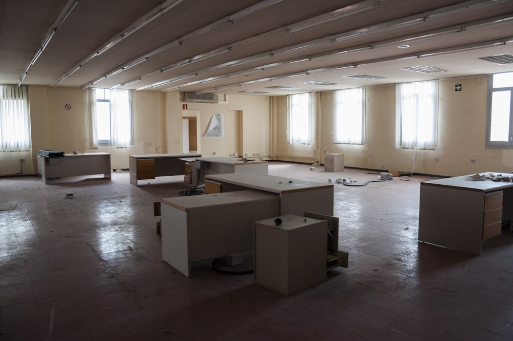 an empty room with several boxes on the floor