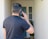 a man holding a cell phone up to his ear