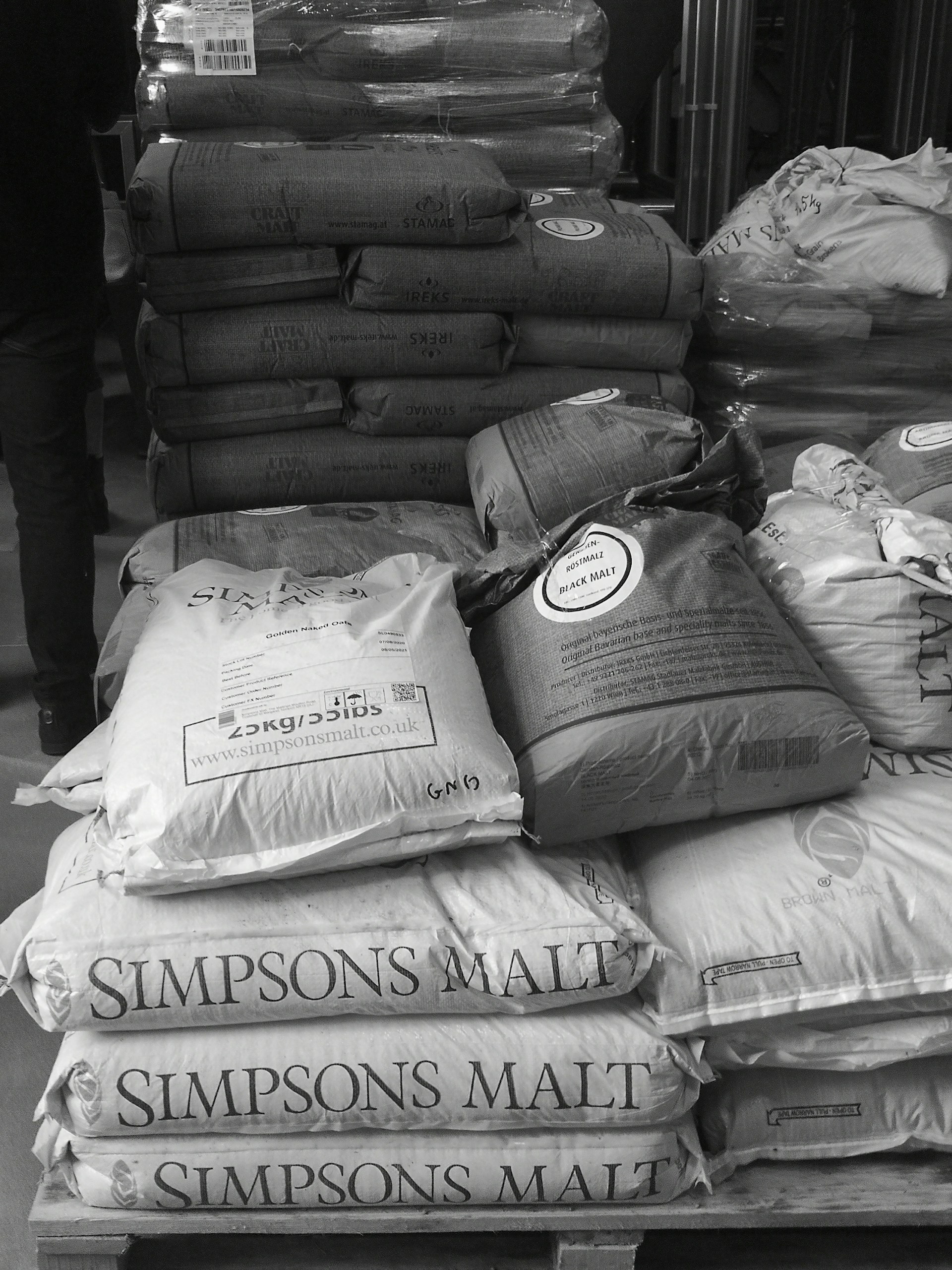 a pile of pillows sitting on top of a wooden table