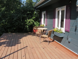a patio with a table and chairs on it
