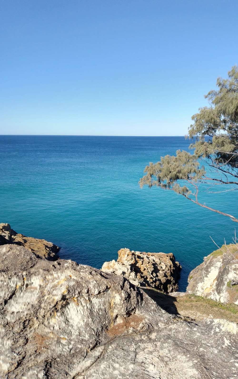 a view of a body of water from a cliff