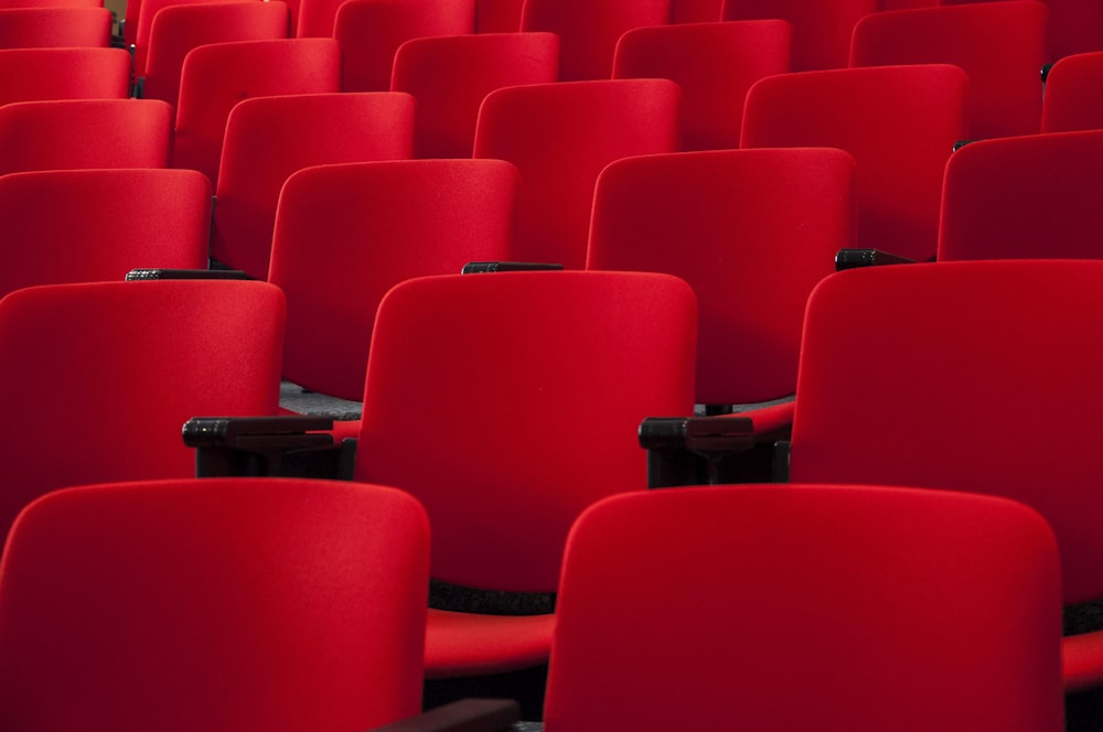 rows of red seats in a theater or auditorium