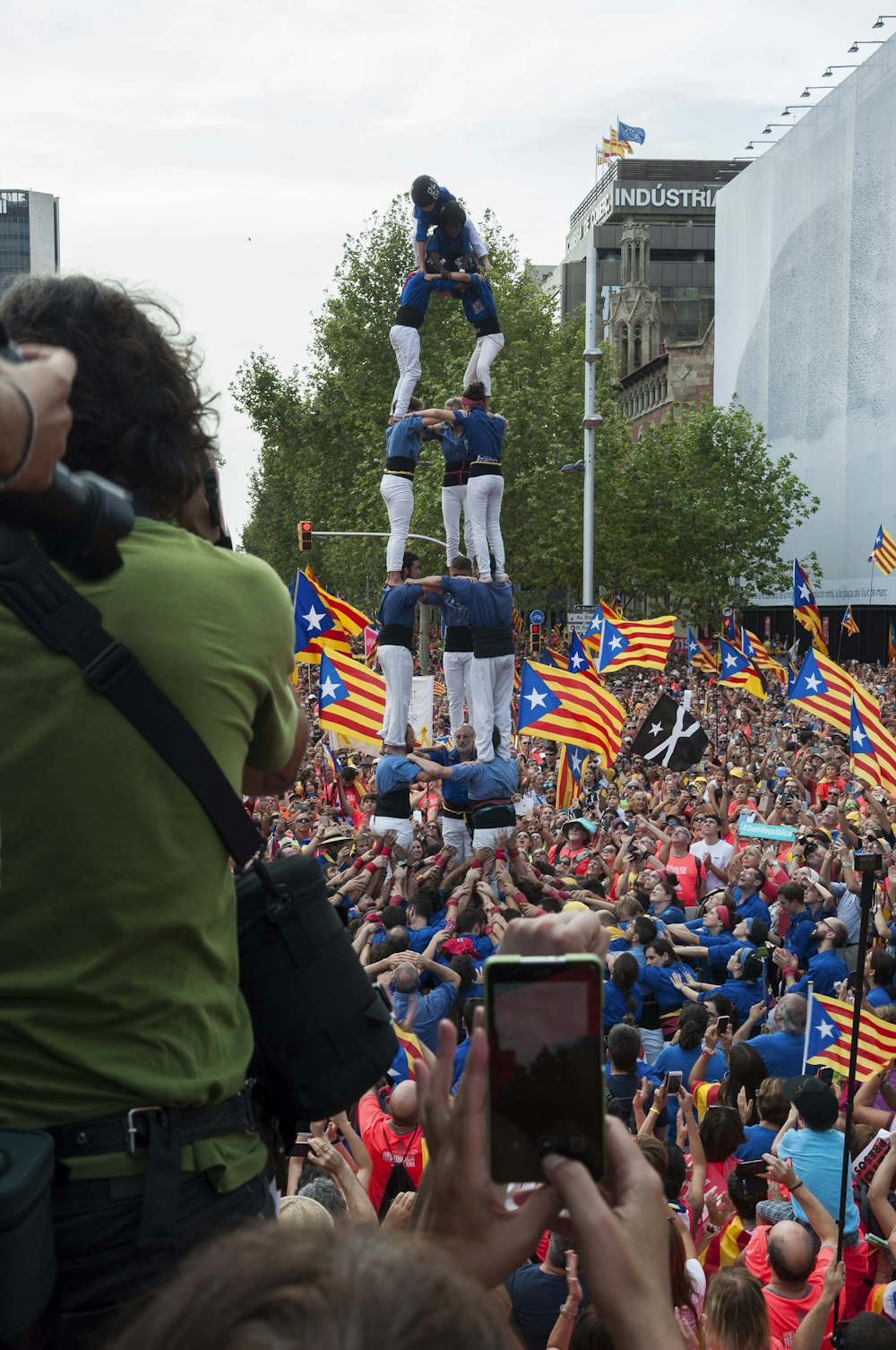 a large crowd of people watching a parade