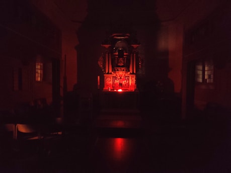 A dark and mystical temple setting representing Quimbanda.