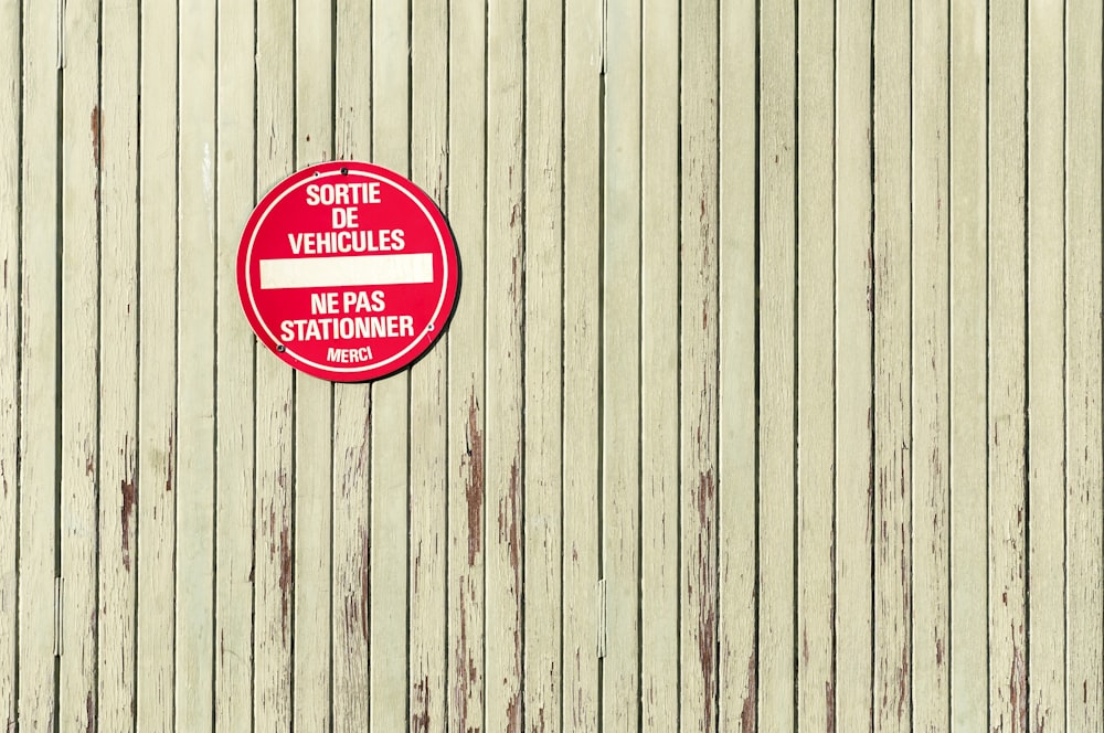 a red sign on the side of a building