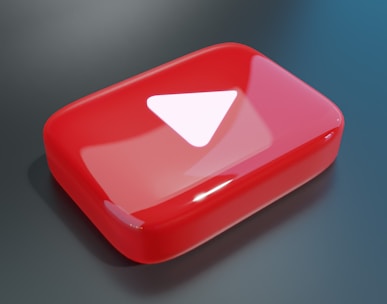 a red object with a white triangle on it