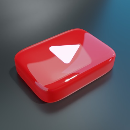 a red object with a white triangle on it