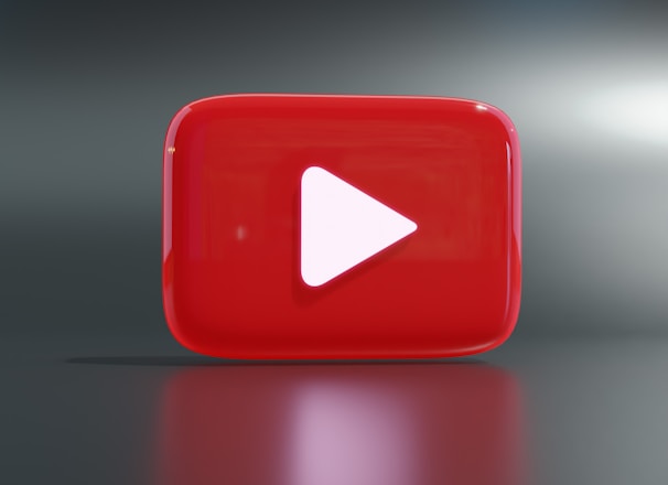 a red play button sitting on top of a table