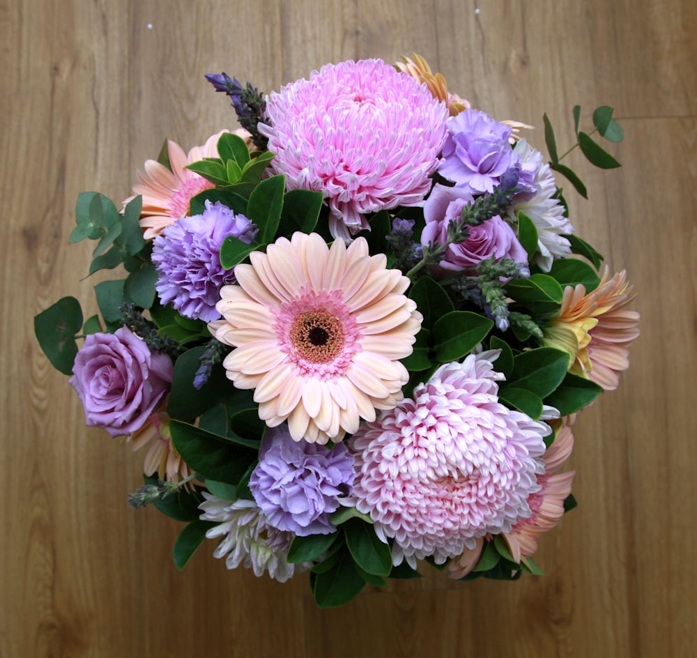 a bouquet of flowers on a wooden table