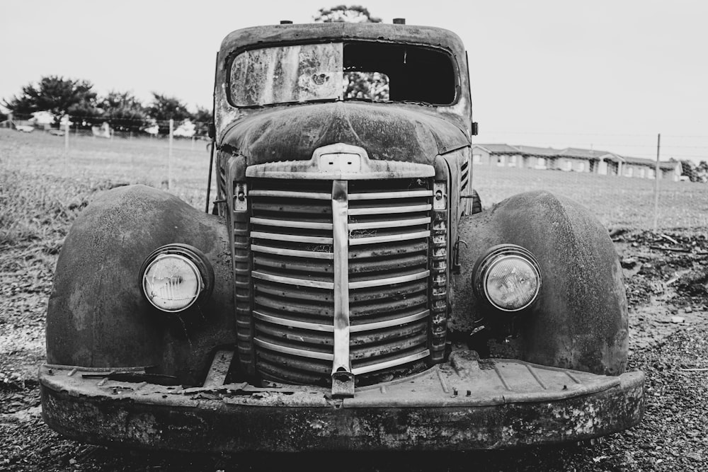 a black and white photo of an old truck