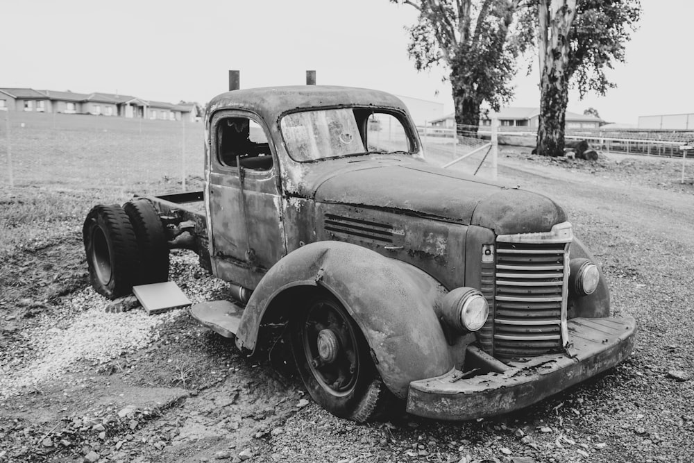 a black and white photo of an old truck