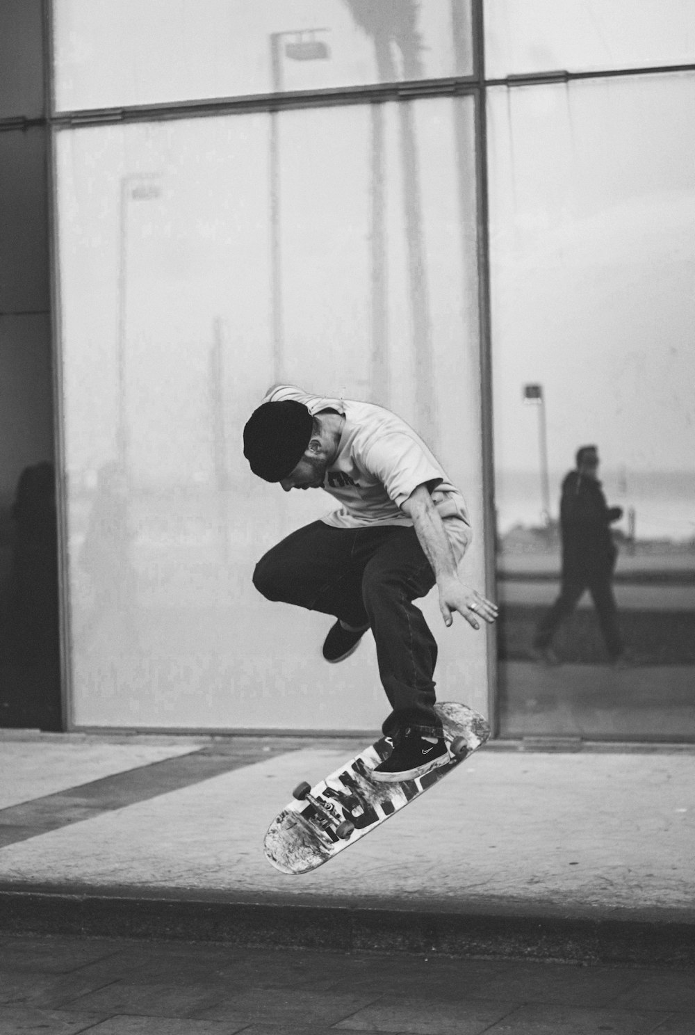 a man flying through the air while riding a skateboard