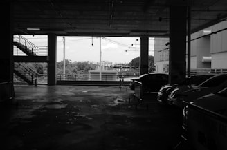 a black and white photo of a parking garage