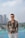 a man standing in front of a swimming pool