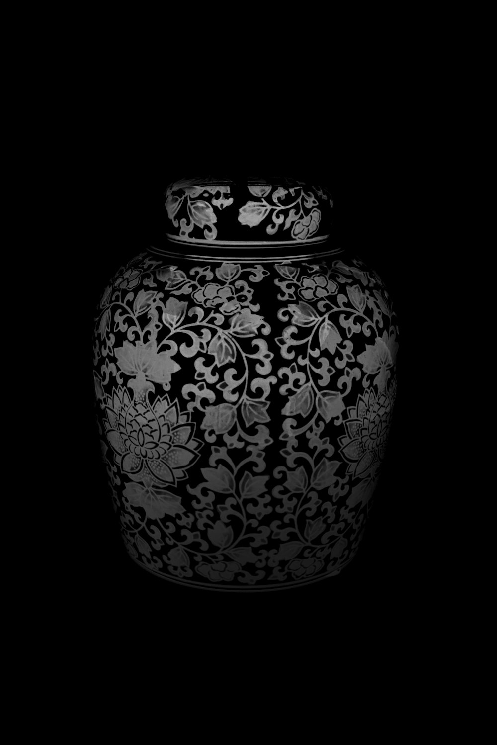 a black and white photo of a vase