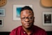 a man wearing glasses and a red shirt