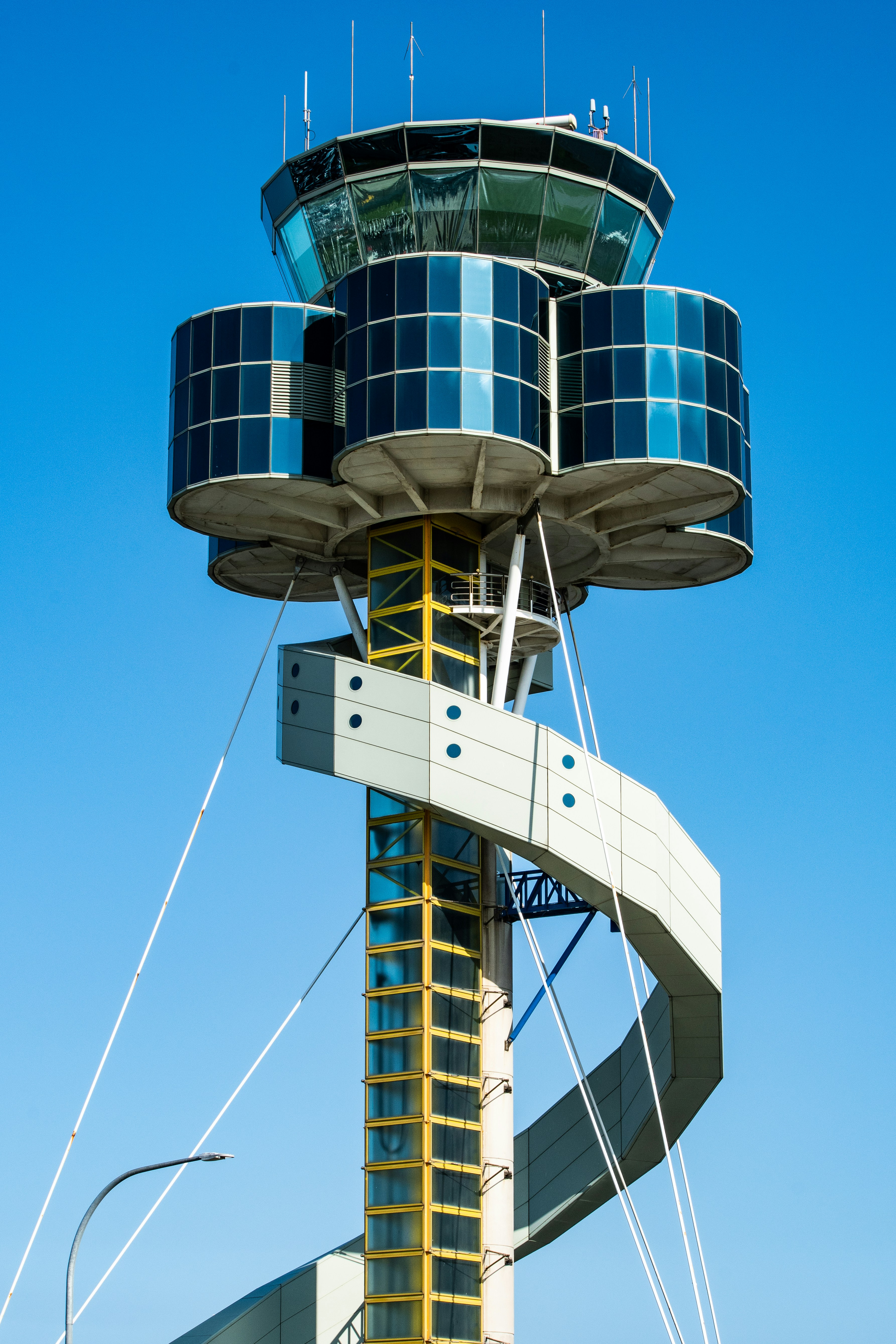 a tall tower with a spiral staircase going up it's side