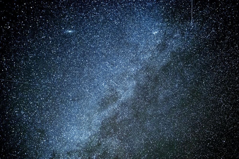 a night sky with stars and the milky