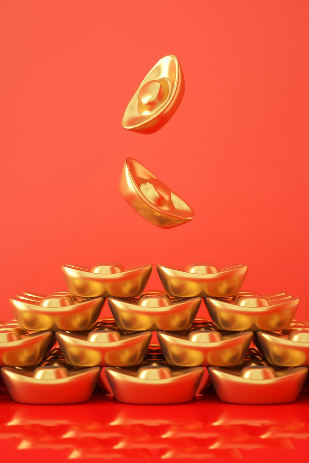 a pile of gold bowls sitting on top of a red table