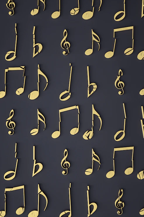 Gold musical notes arranged in a grid pattern on a dark grey background
