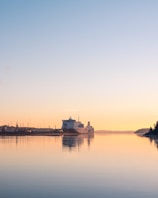 a large body of water with a building in the background