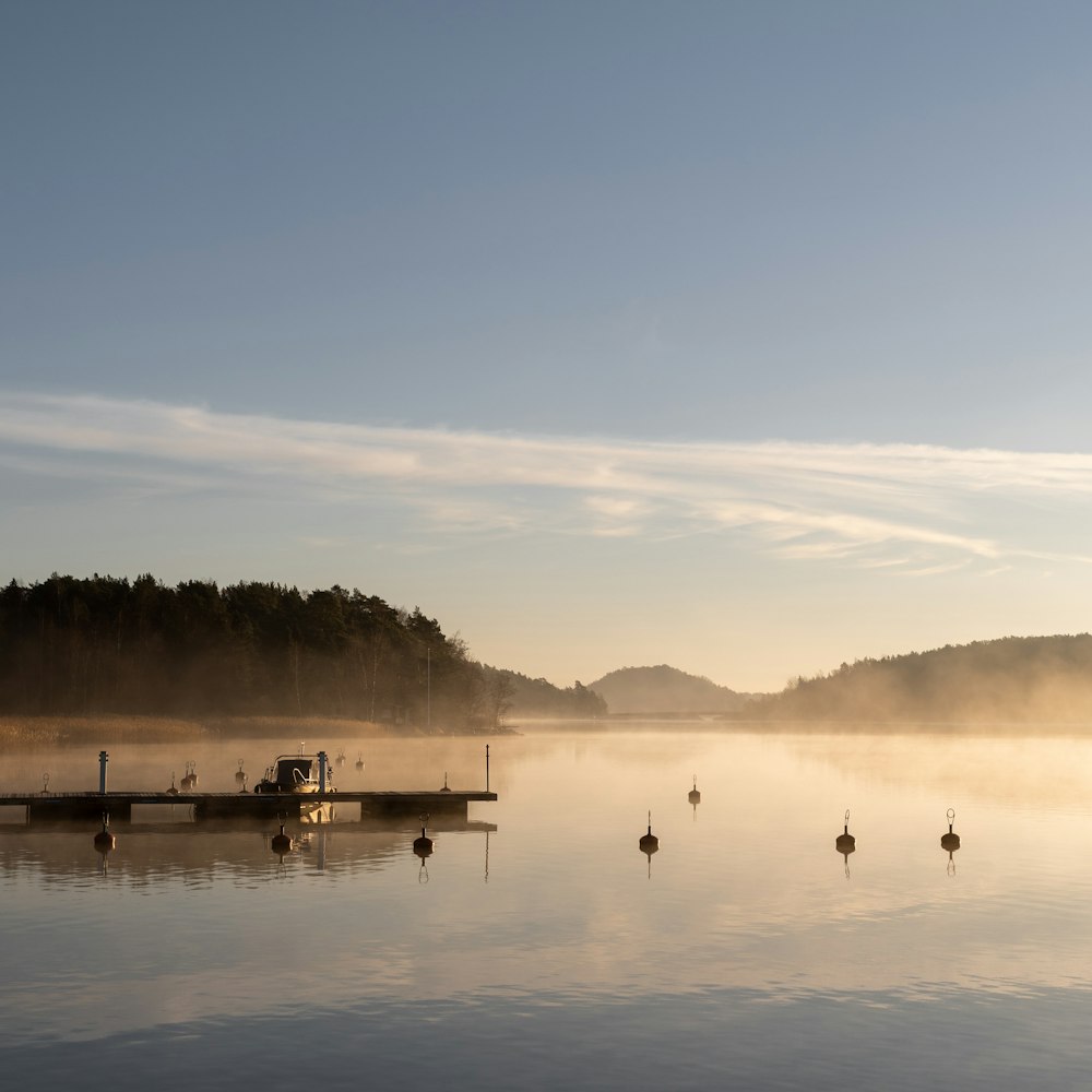 a body of water with a boat in the middle of it