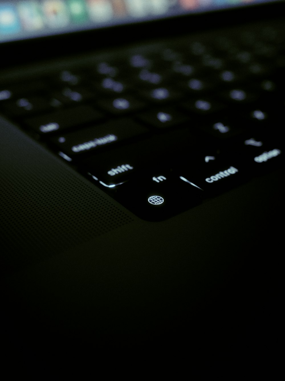 a close up of an open laptop computer sitting on top of a keyboard