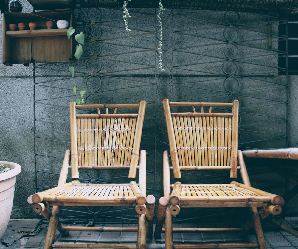 a couple of wooden chairs sitting next to each other