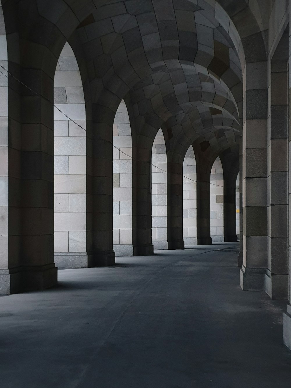 a row of arches in a stone building