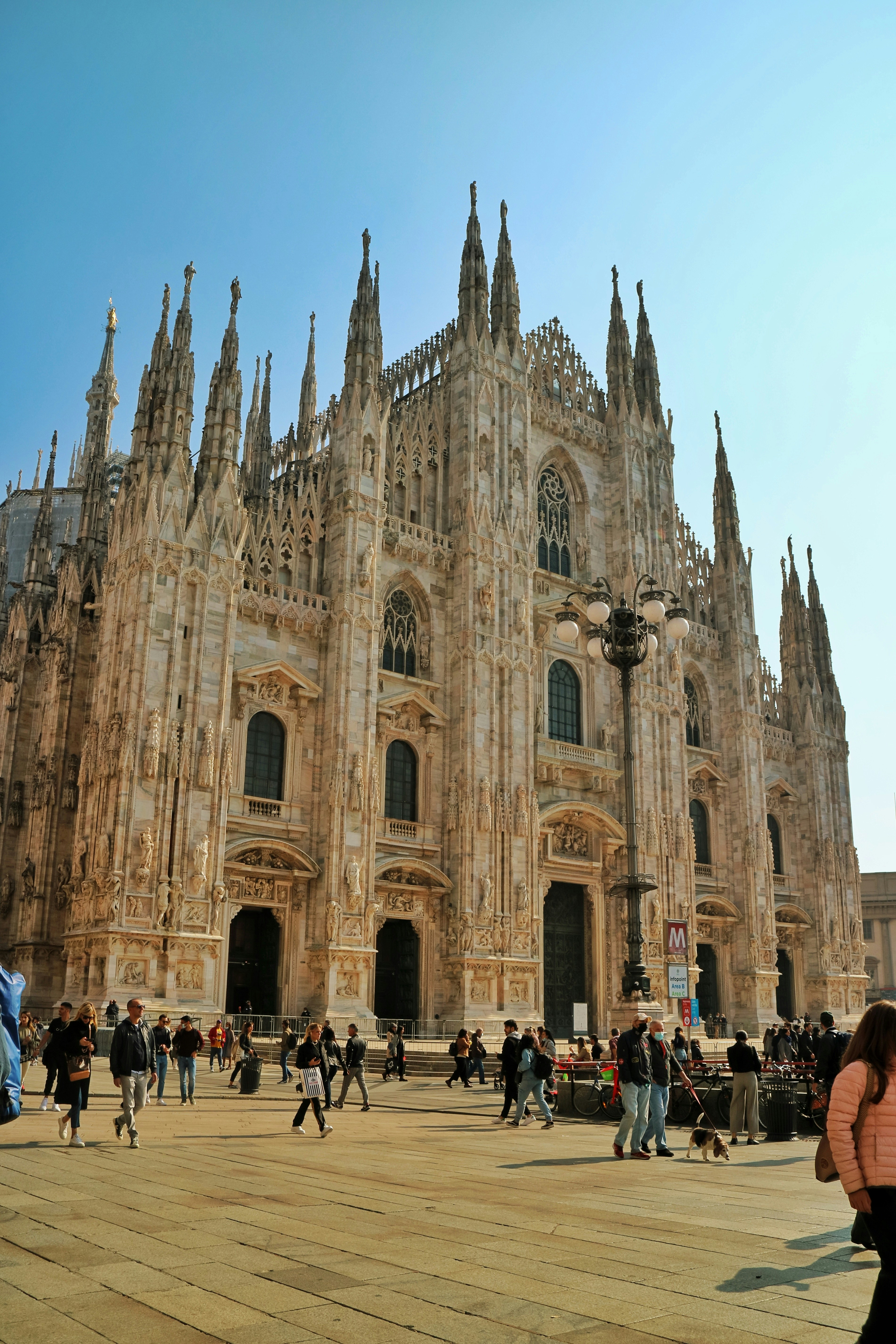 a group of people standing in front of a large building