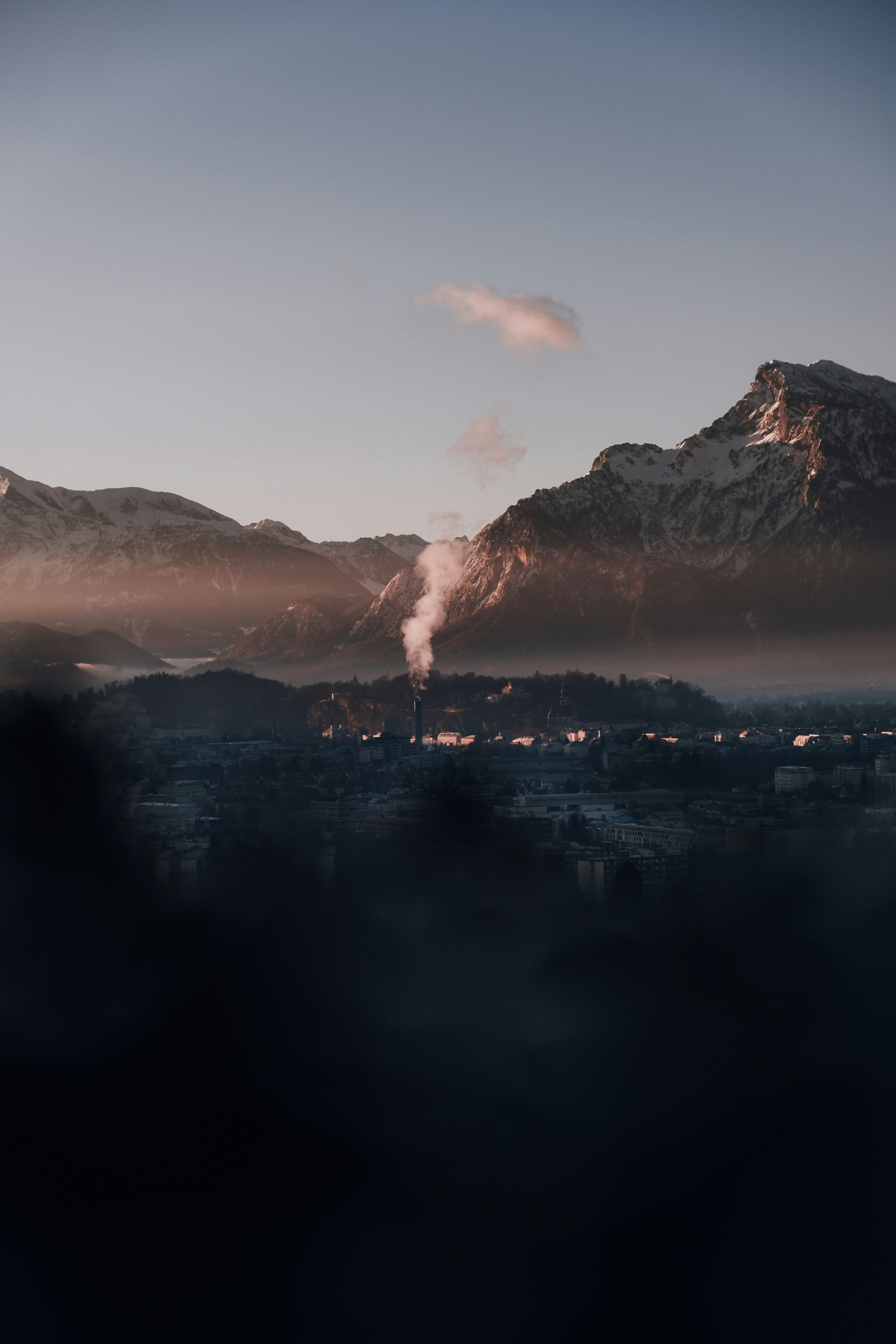 a view of a city with mountains in the background