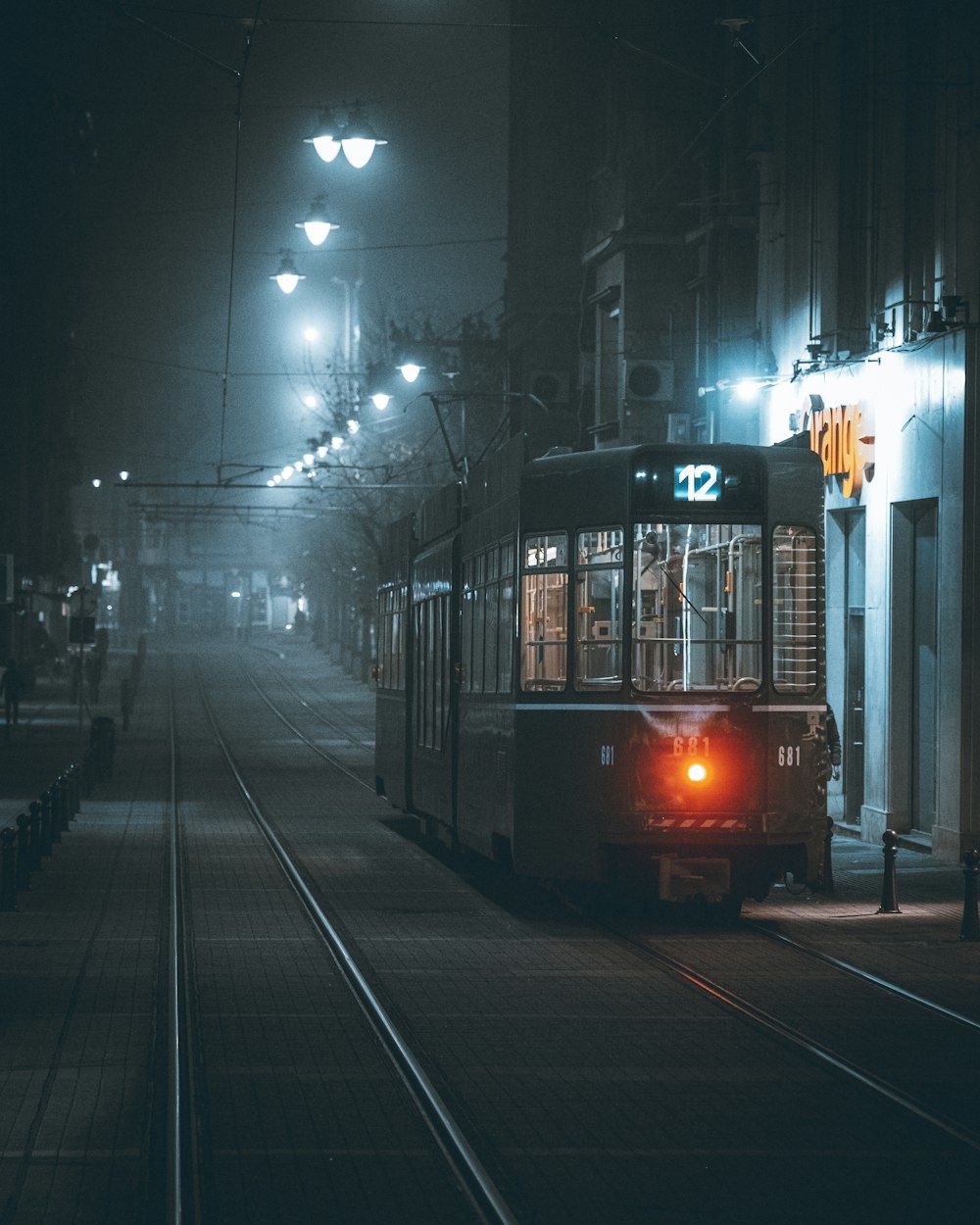a trolley on a city street at night
