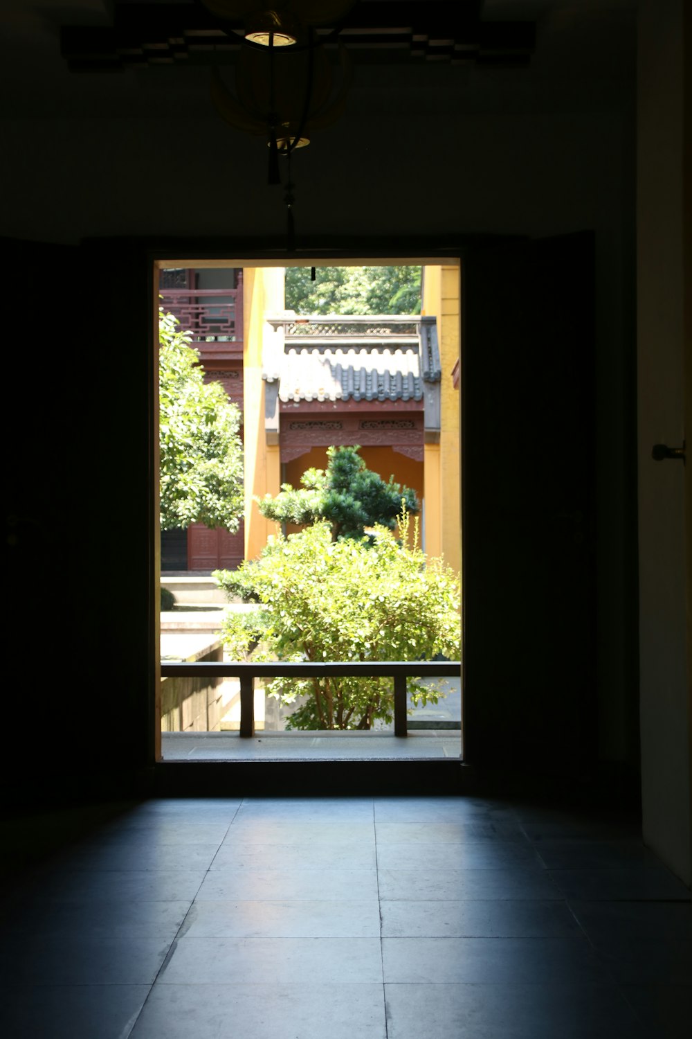 an open door with a view of a courtyard