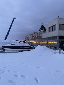 a boat that is sitting in the snow