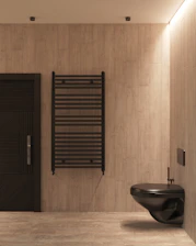 a bathroom with a toilet, sink and a radiator