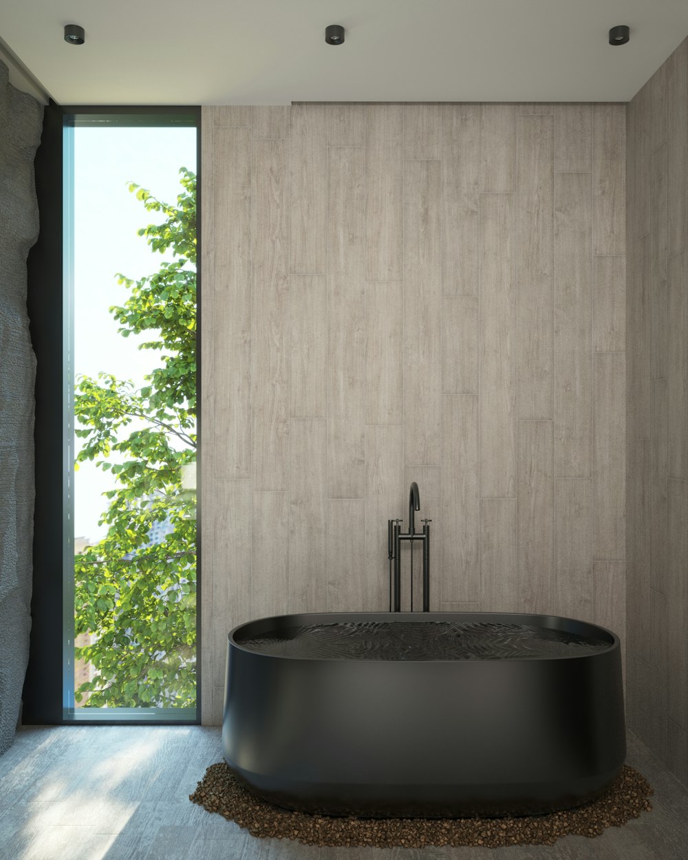 a large black bath tub sitting next to a window