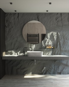 a bathroom with a sink and a mirror