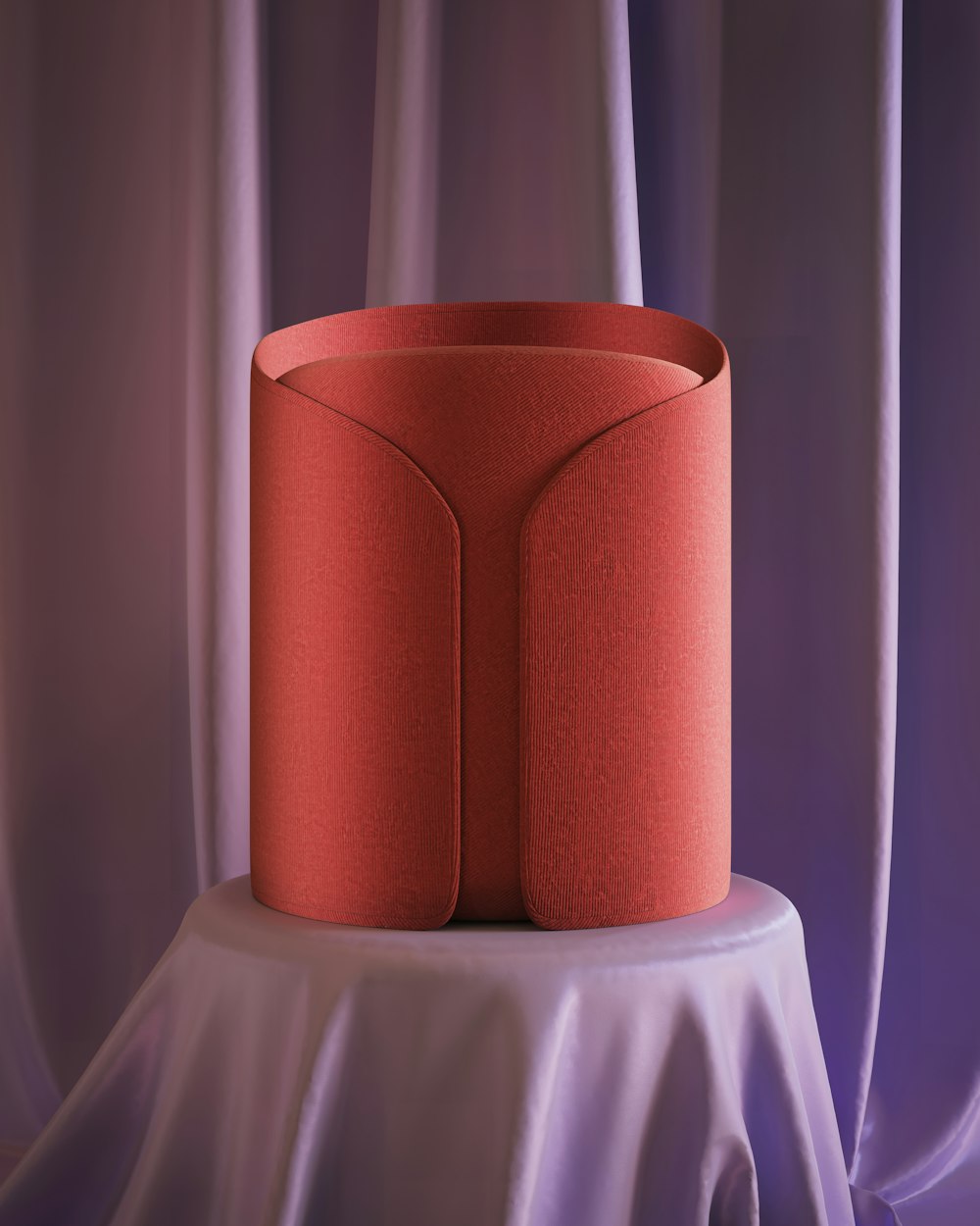 a red vase sitting on top of a table