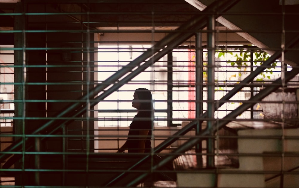 a person sitting on a bench in a building