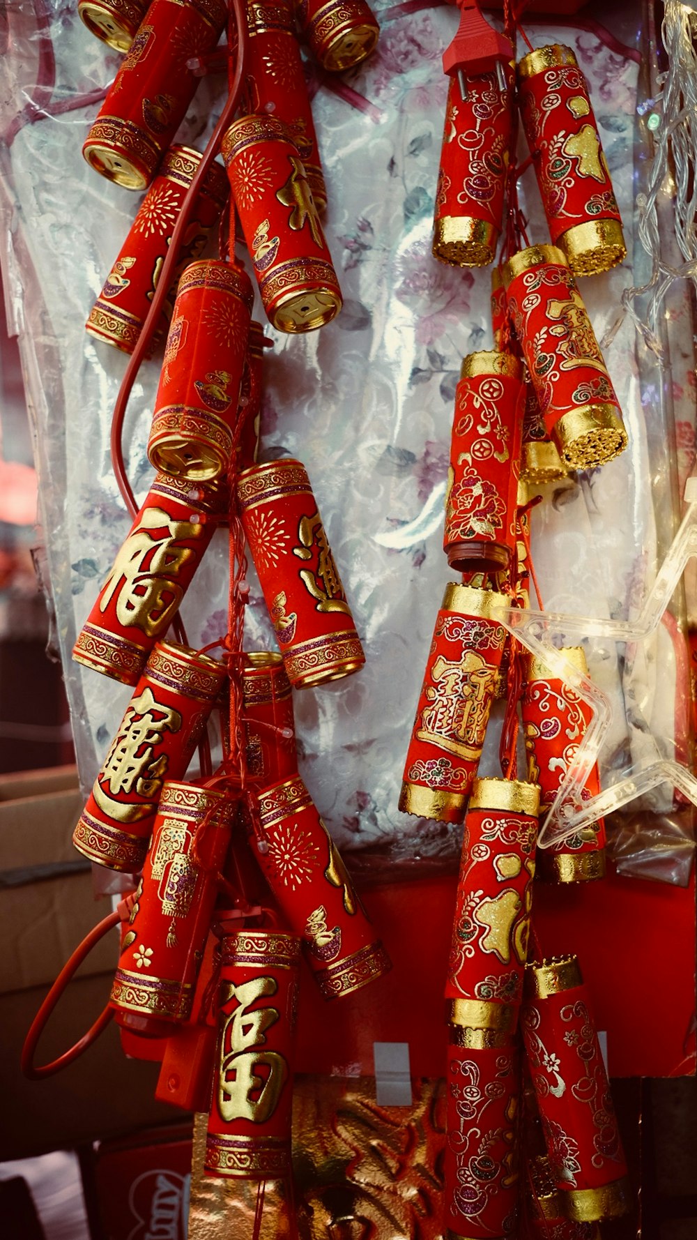 a bunch of red and gold items hanging on a wall